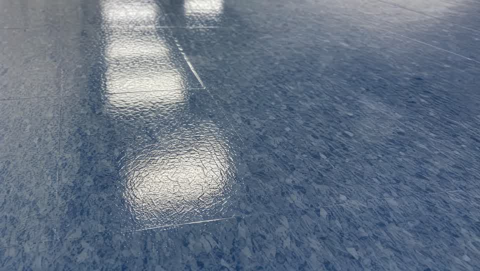 Close-up of a glossy commercial floor finish surface