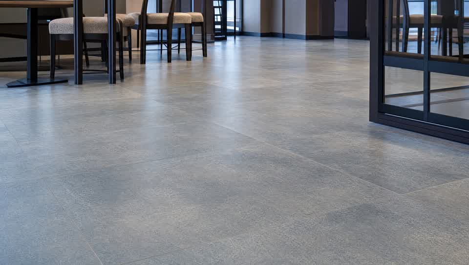 Freshly cleaned and sealed commercial ceramic tile floor with clean grout lines