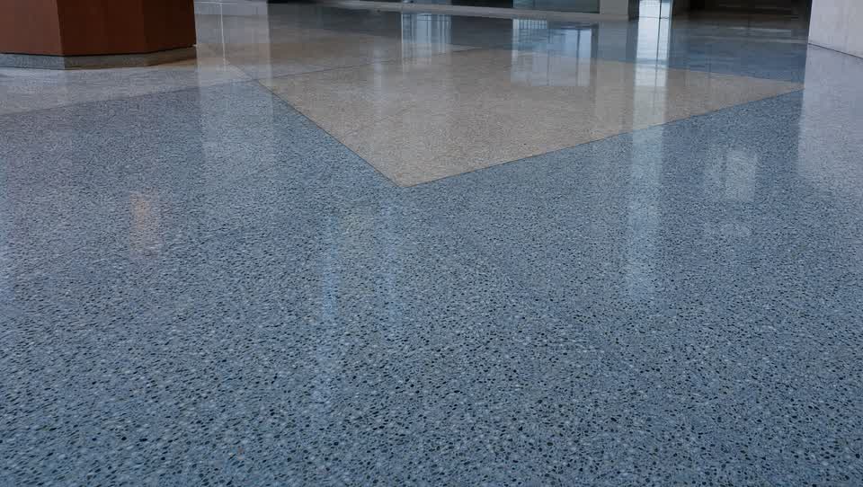 Polished terrazzo floor with a classic speckled composite surface